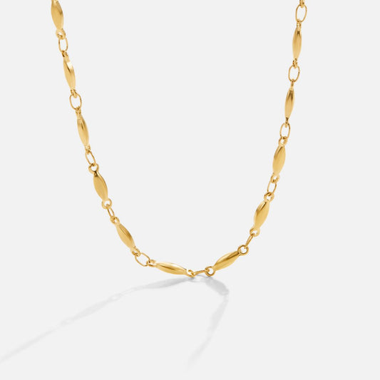 Frieda – Collana dorata con pendente curvo