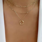 Beata – Collana dorata con piccole decorazioni in pietra