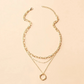 Beata – Collana dorata con piccole decorazioni in pietra