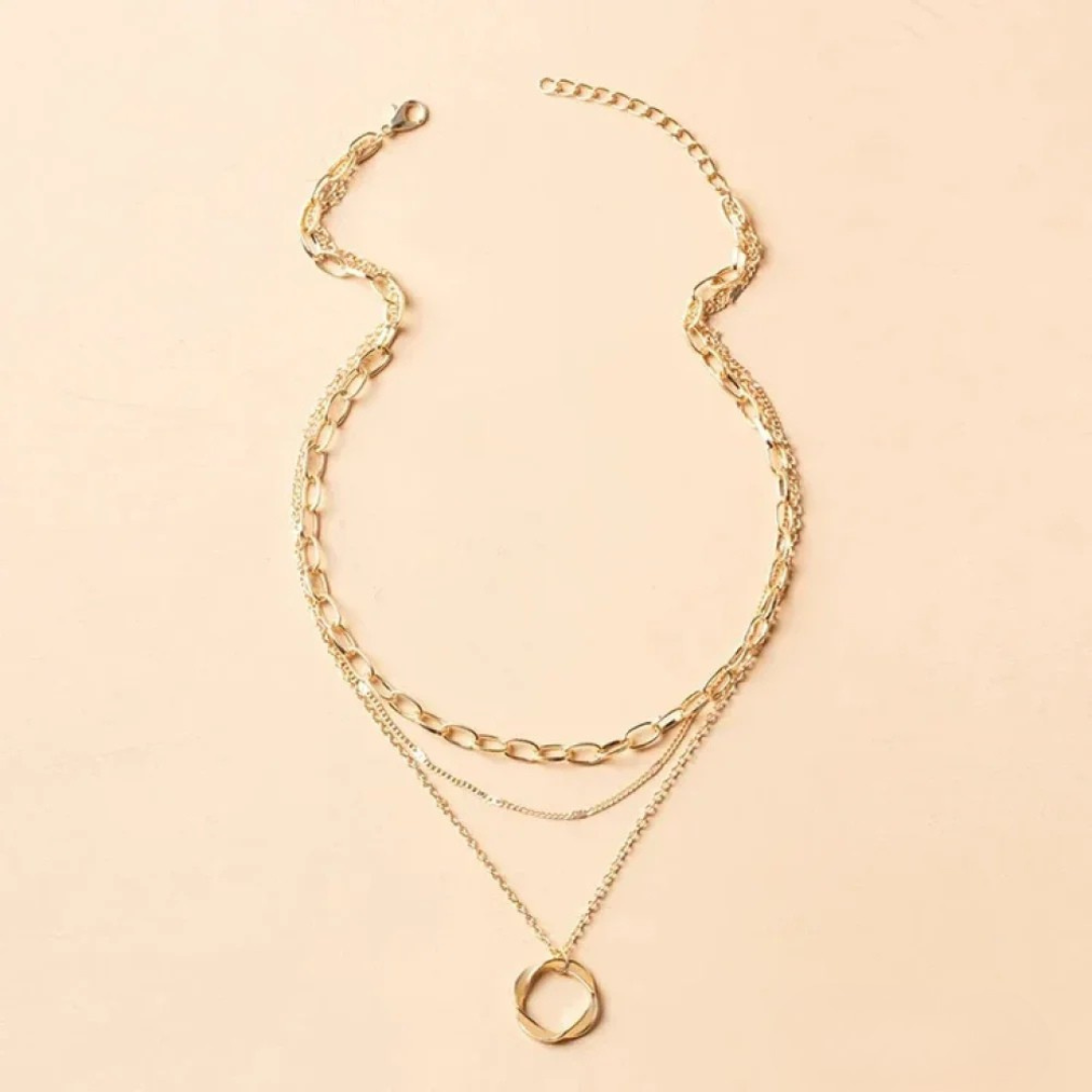 Beata – Collana dorata con piccole decorazioni in pietra