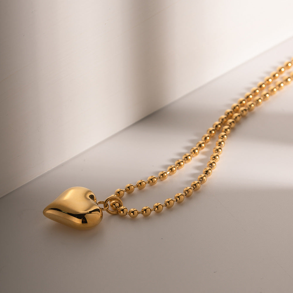 Amálie – Collana in oro con medaglione moderno.