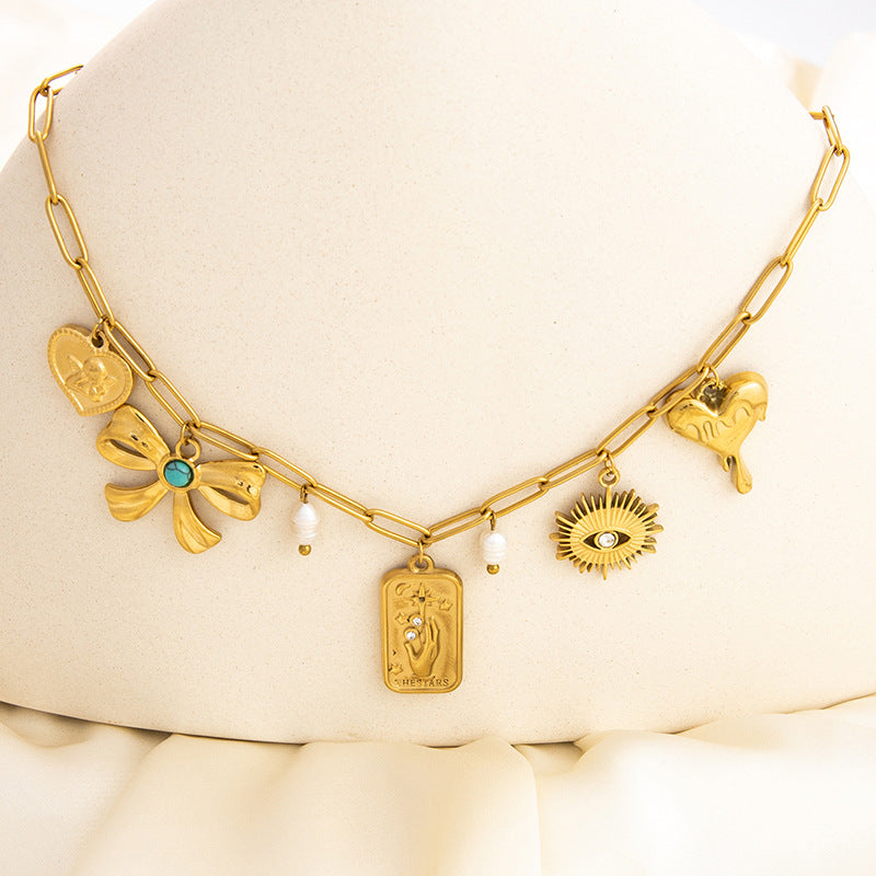Emilie – Collana dorata delicata con piccoli pendenti