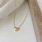 Klara – Collana dorata con pendente rotondo
