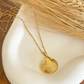 Annika – Collana dorata con pendente rotondo