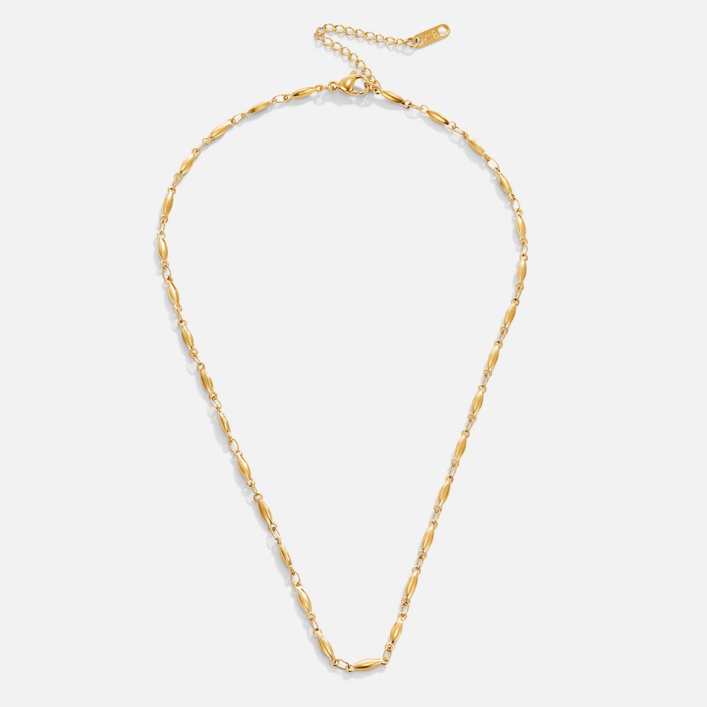 Frieda – Collana dorata con pendente curvo