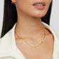 Frieda – Collana dorata con pendente curvo