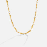 Frieda – Collana dorata con pendente curvo