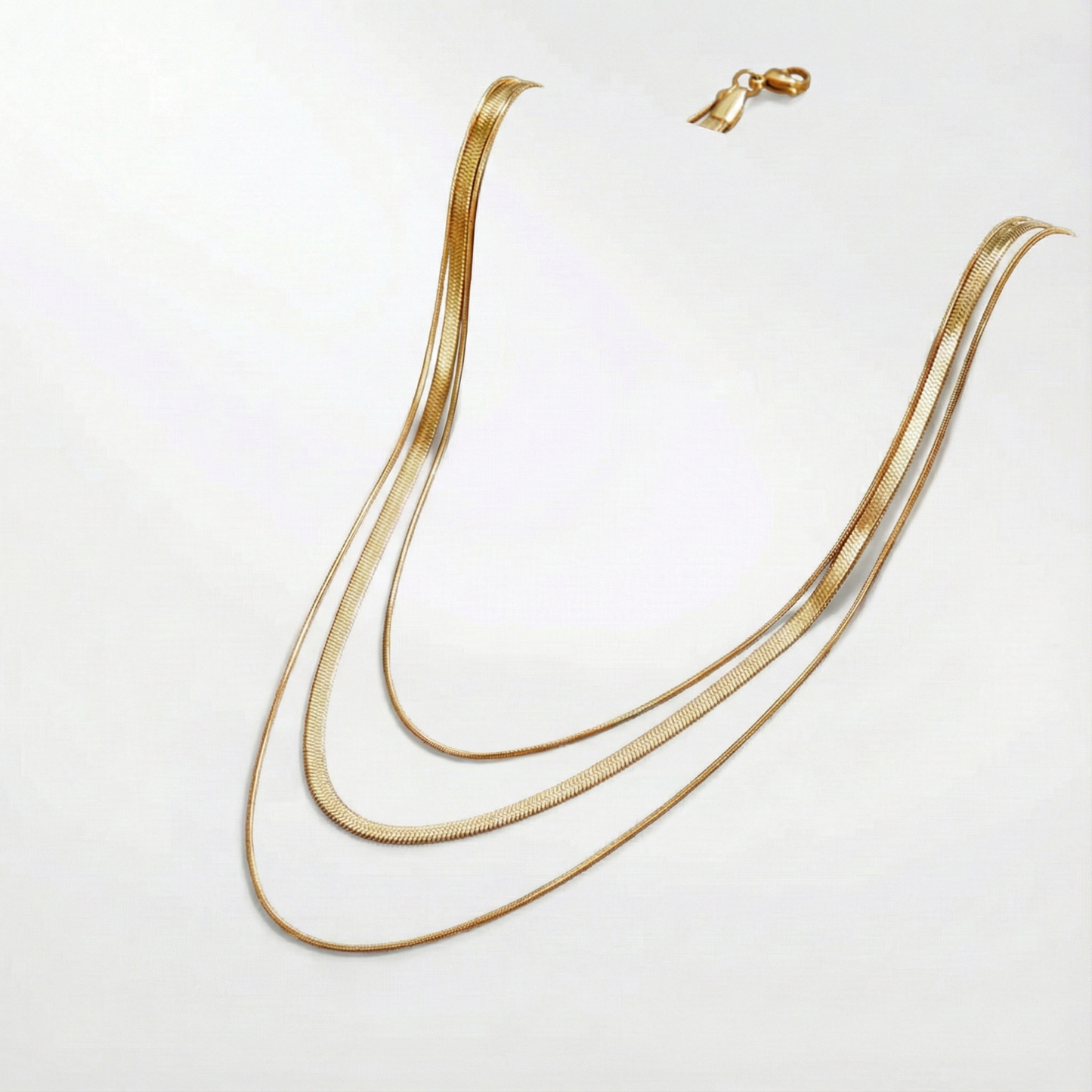 Antonie – Collana in oro multistrato dalla struttura trasparente.