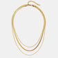 Antonie – Collana in oro multistrato dalla struttura trasparente.