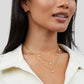 Tanja – Collana dorata stratificata con maglia moderna