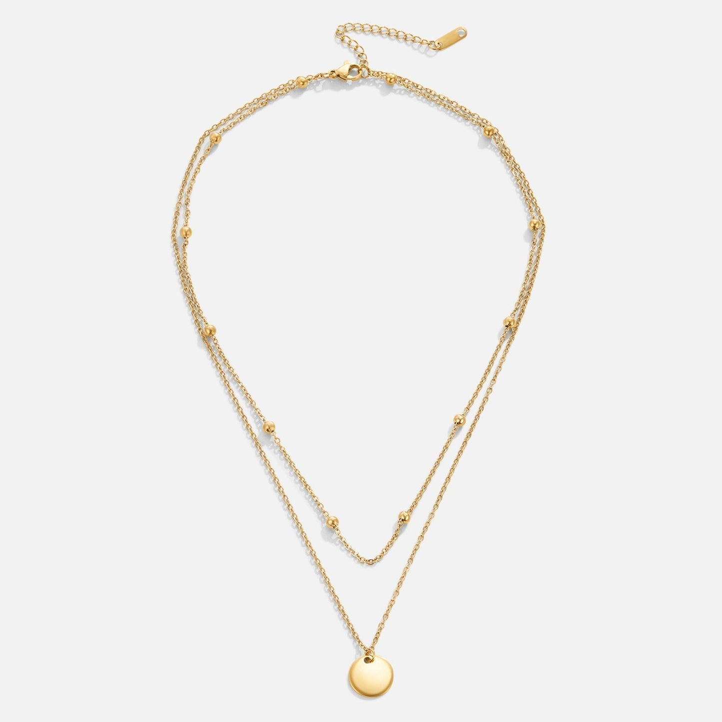 Leona – Collana dorata doppia con pendente rotondo