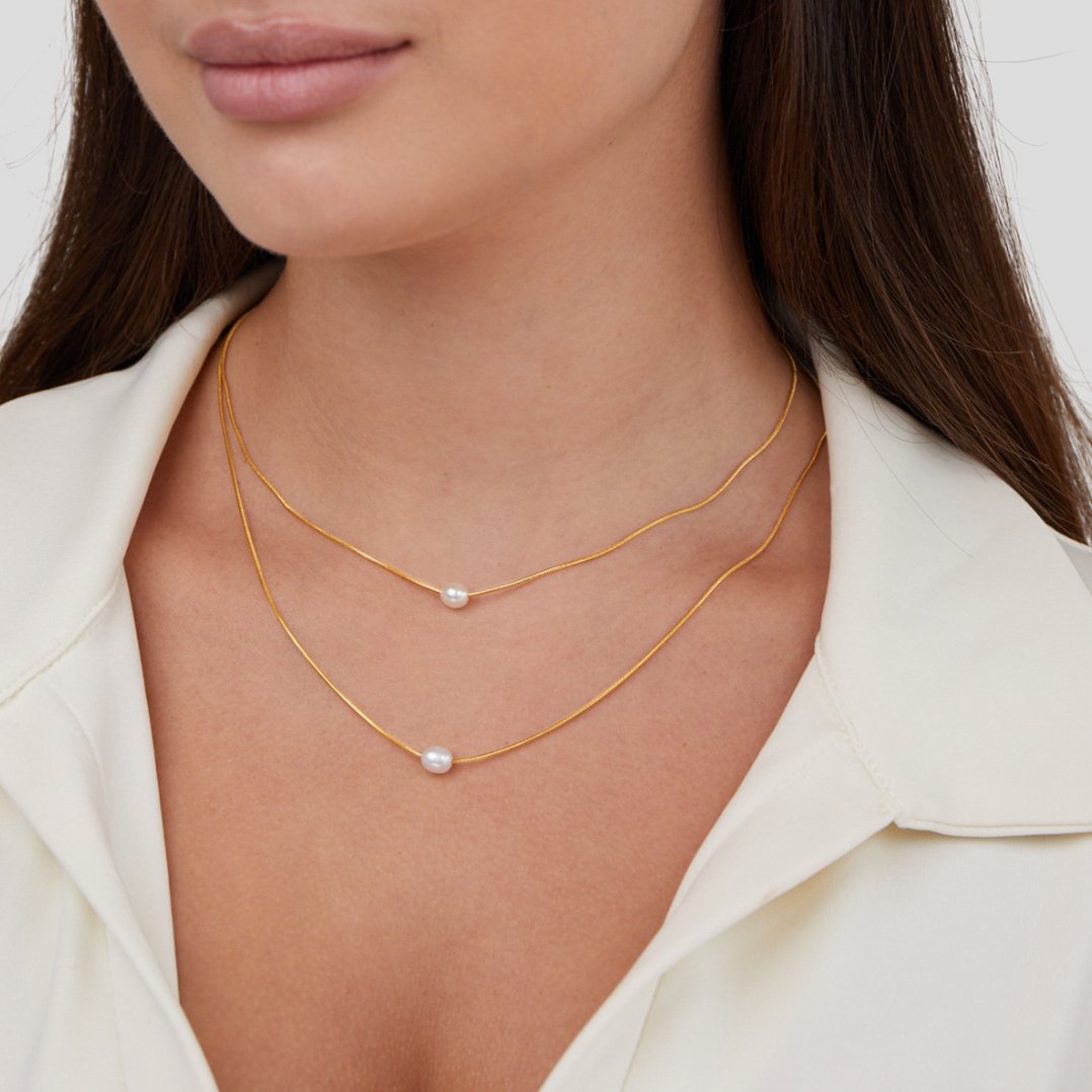 Nora – Collana dorata dal design a catena