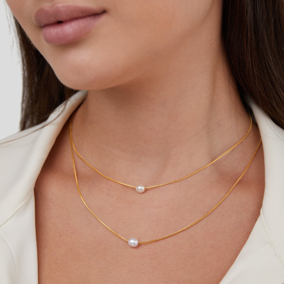 Nora – Collana dorata dal design a catena