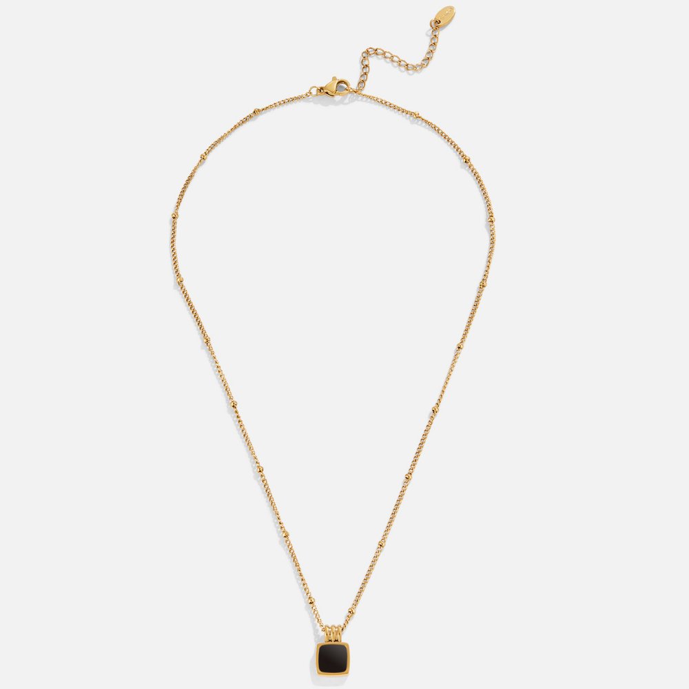 Selina - Collana in oro con pietra scura.