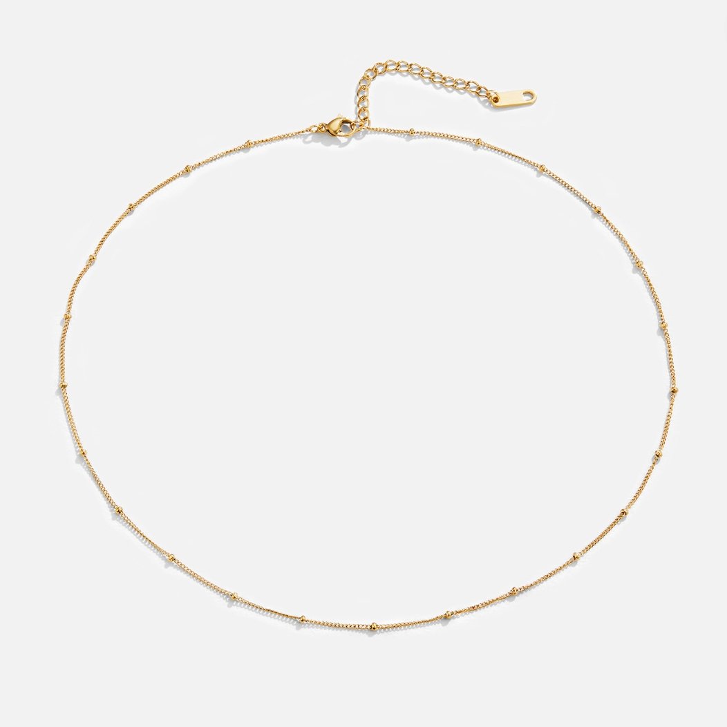 Fiona – Collana dorata con mini charm